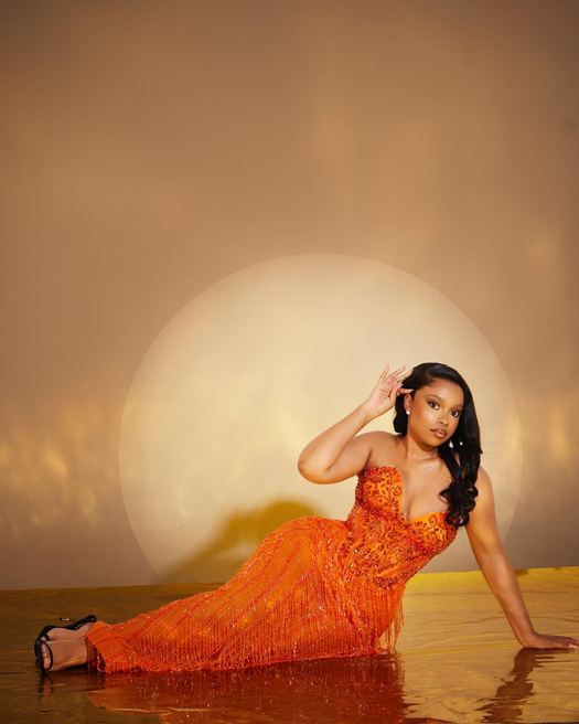 Tarine — Burnt orange, plunging, with fine beaded fringe falling the whole length of the skirt.